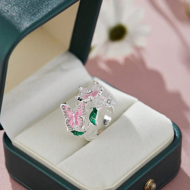 Anillo ajustable flor de cerezo y mariposa plata