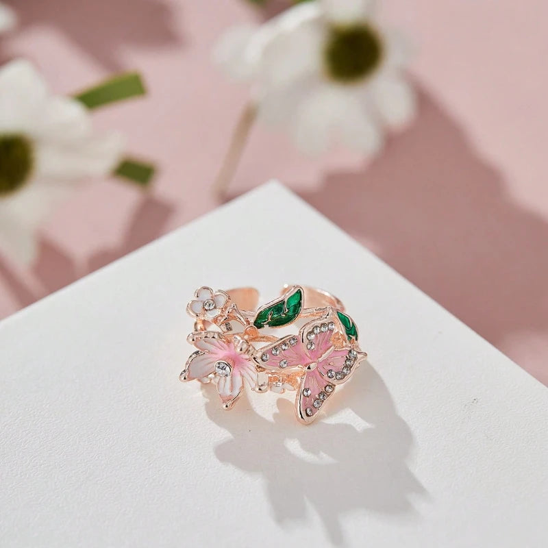 Anillo ajustable flor de cerezo y mariposa oro rosa
