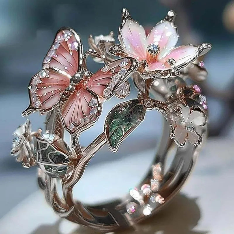 Anillo ajustable flor de cerezo y mariposa plata