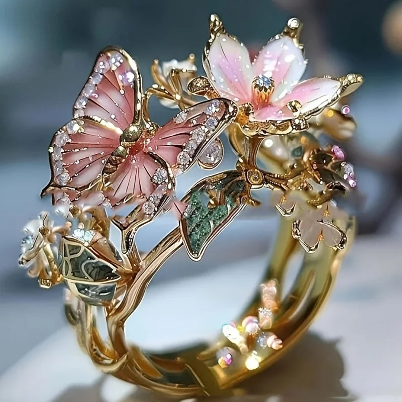 Anillo ajustable flor de cerezo y mariposa oro