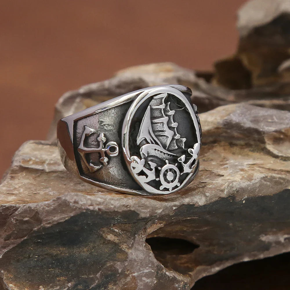 Anillo ancla y barco