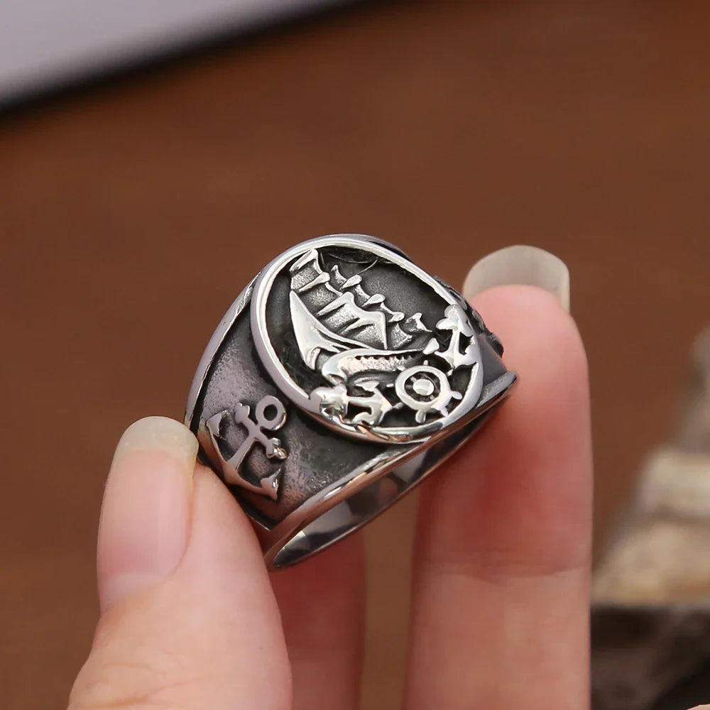 Anillo ancla y barco