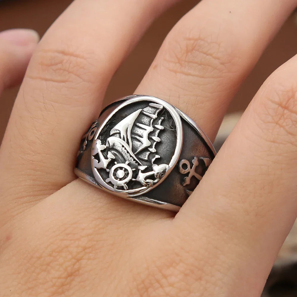 Anillo ancla y barco