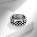 Anillo con cuadrados negros antiestrés giratorio