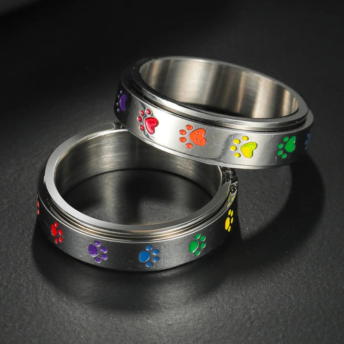 Anillo con corazones o patas anti-estrés giratorias corazón