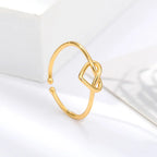 Anillo de corazón entrelazado oro