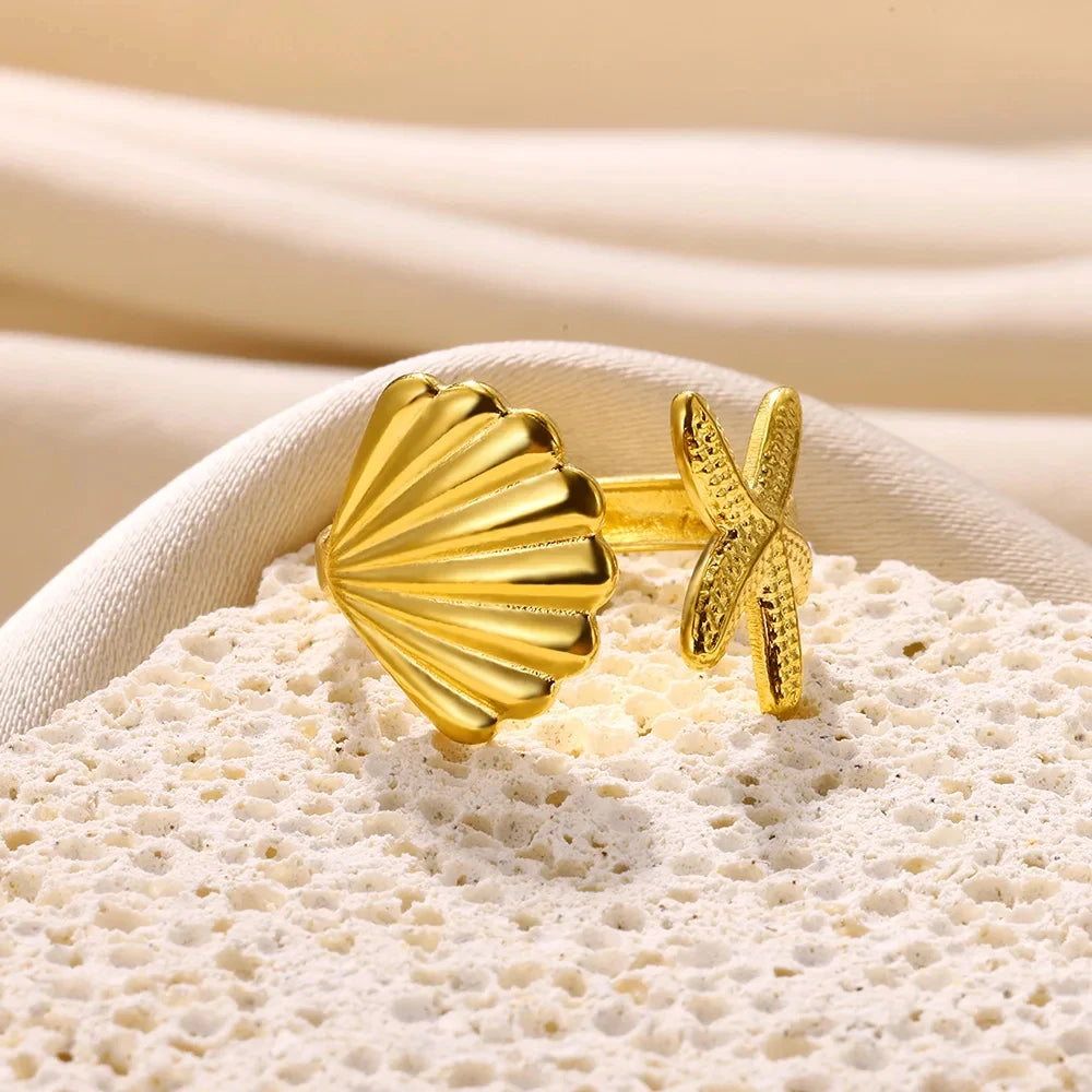 Anillo con concha y estrella de mar