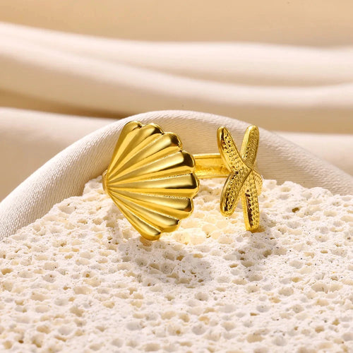 Anillo con concha y estrella de mar