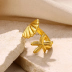 Anillo con concha y estrella de mar