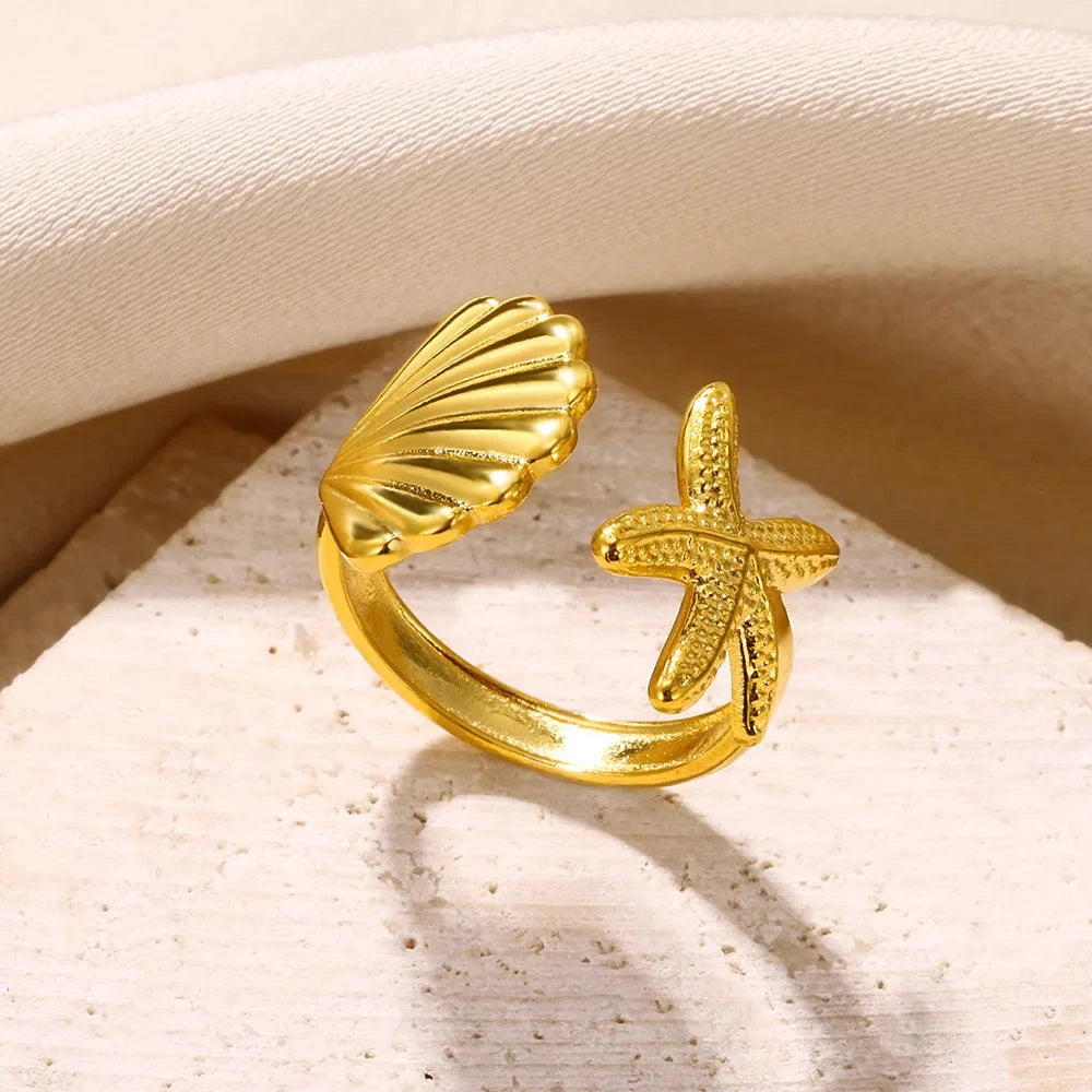 Anillo con concha y estrella de mar