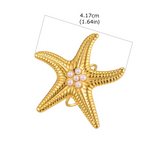 Anillo de concha y estrella de mar dorada