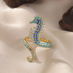 Anillo con concha y caballito de mar azul