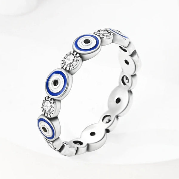 Anillo de protección con incrustaciones de ojo azul y cristales