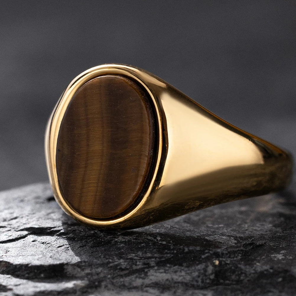 Gold-tone ring with oval tiger's eye stone