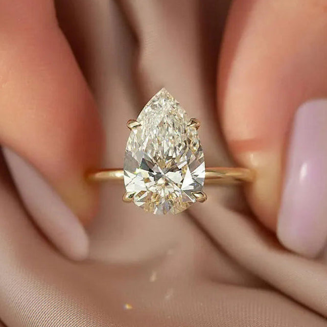 Slim ring with large teardrop crystal gold