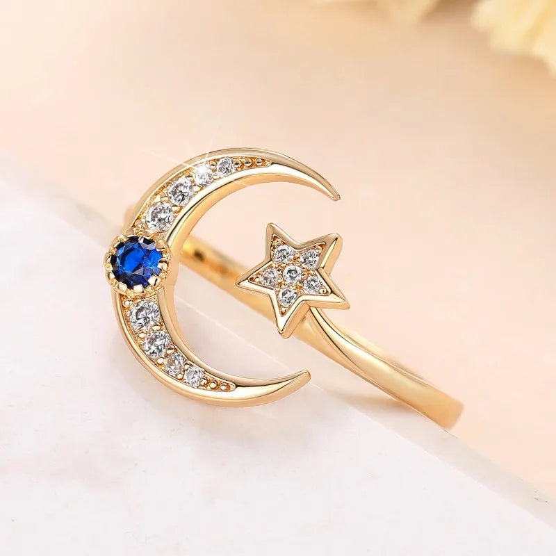 Anillo abierto "noche estrellada" media luna y su cristal azul