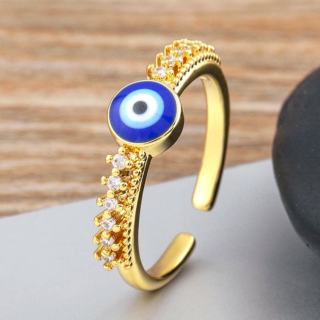 Anillo abierto pavé de cristales con incrustación de ojo azul