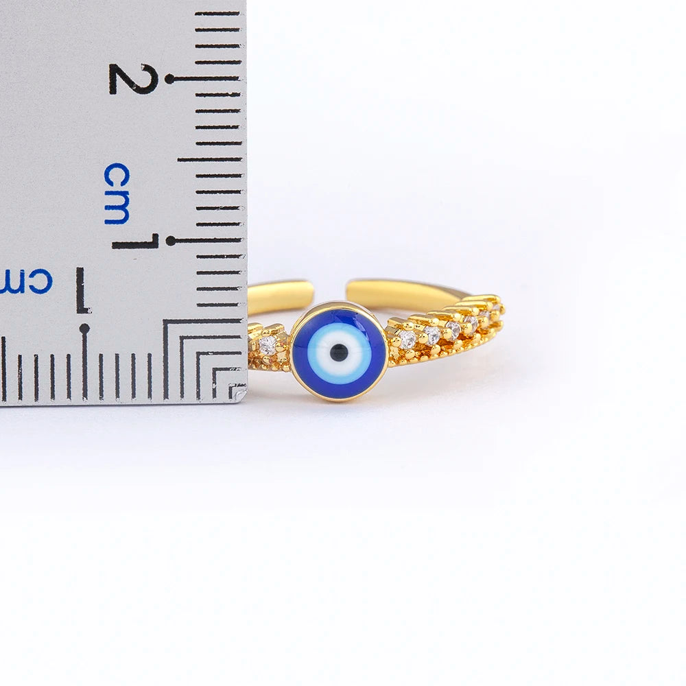 Anillo abierto pavé de cristales con incrustación de ojo azul
