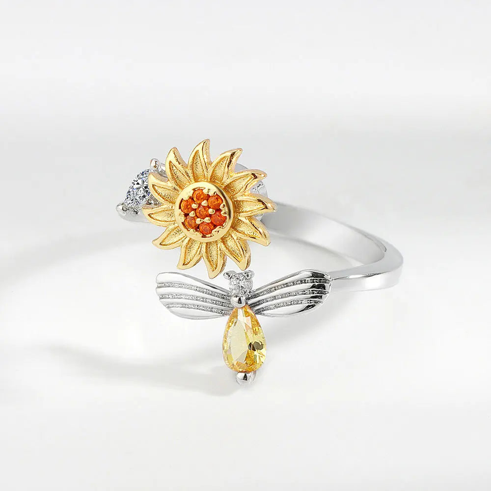 Anillo abeja y flor giratoria