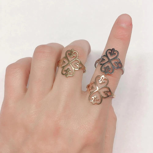 Openwork four-heart clover ring