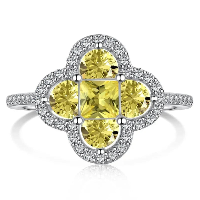 Anillo trébol luminoso de cristales plateado y amarillo