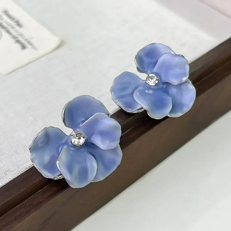 Pendientes de botón flor de cuatro pétalos azul