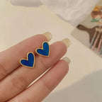 Pendientes de corazón efecto nacarado azul