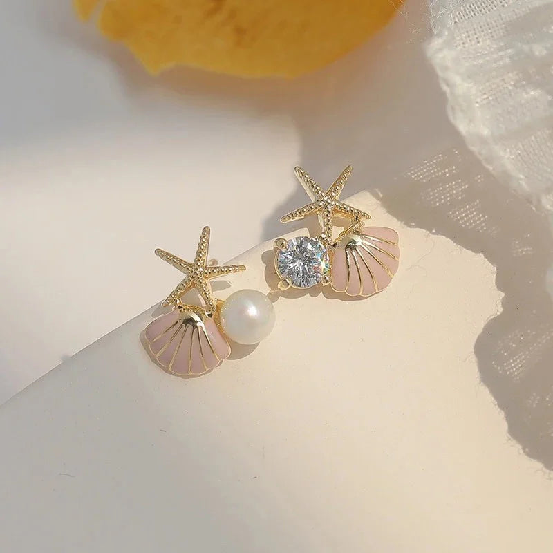 Pendientes de concha asimétricos rosa