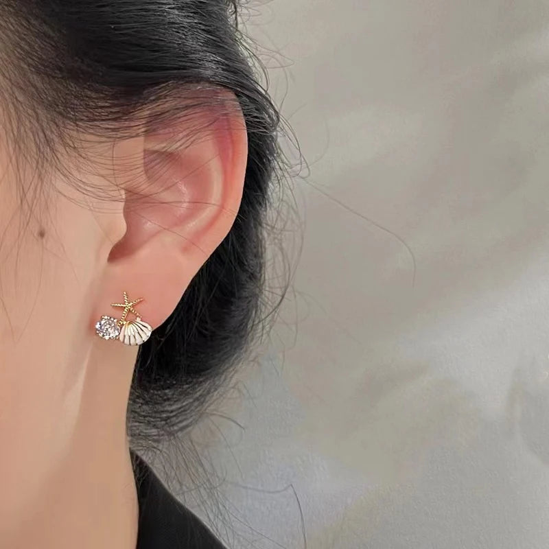 Pendientes de concha asimétricos blanco