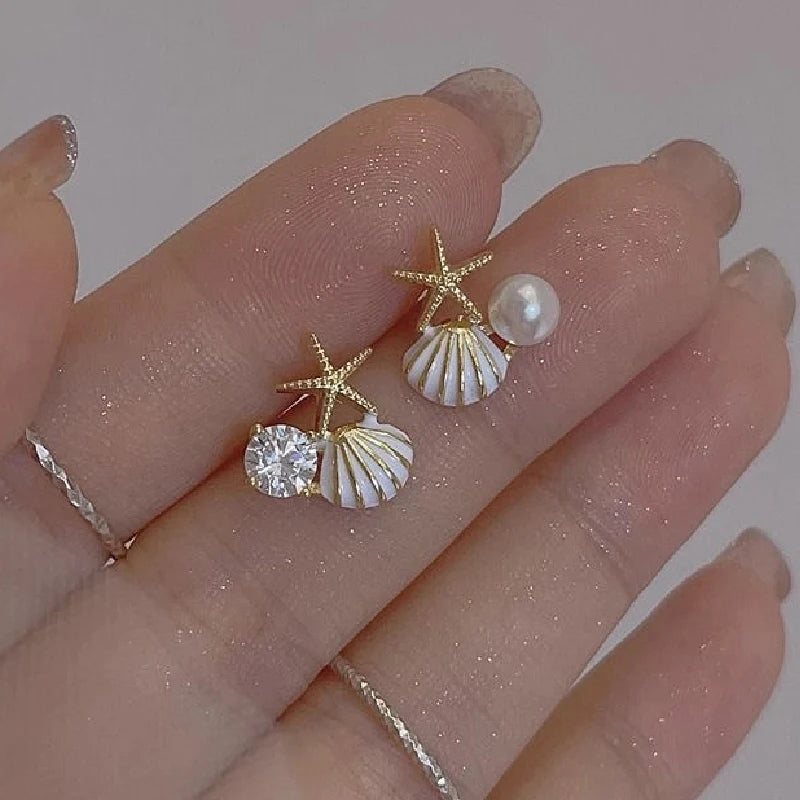 Pendientes de concha asimétricos blanco