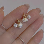 Pendientes de concha asimétricos blanco
