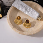 Gold shell earrings and tiger's eye stone