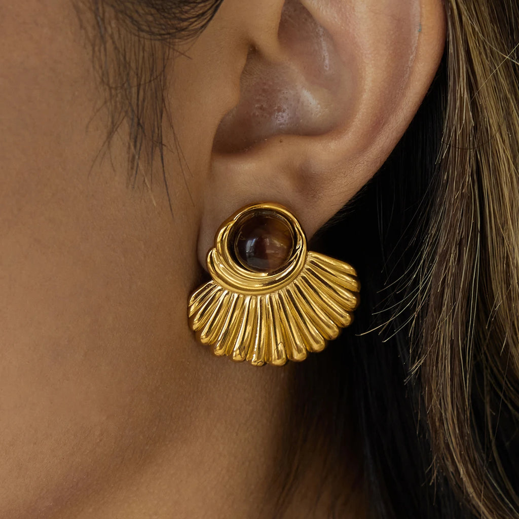 Gold shell earrings and tiger's eye stone