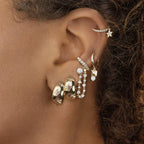 Pendientes de aro abombados con estrellas grabadas