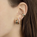 Pendientes de aro abombados con estrellas grabadas dorado