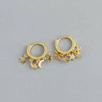 Pendientes de aro con estrellas y lunas colgantes dorados