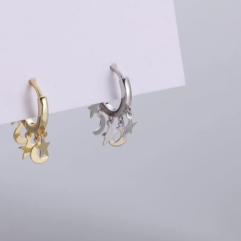 Pendientes de aro con estrellas y lunas colgantes plateados