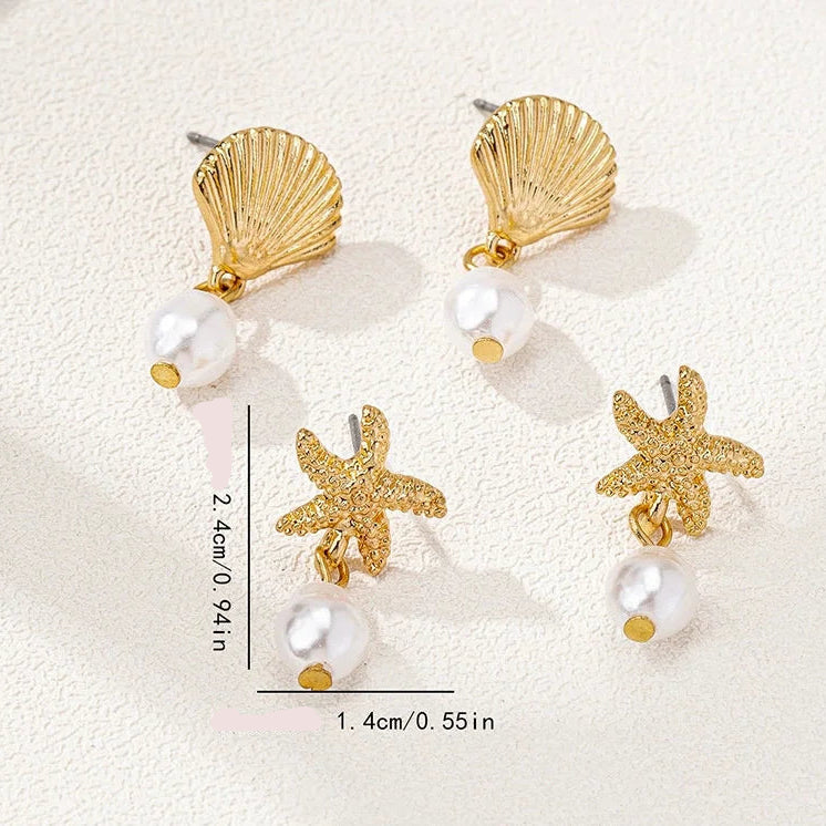 Pendientes dorados de concha y perla