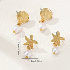 Pendientes dorados de concha y perla