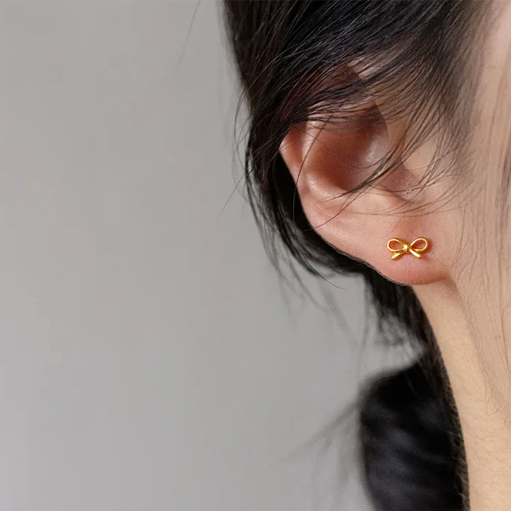 Pendientes minimalistas lazo de moño dorado