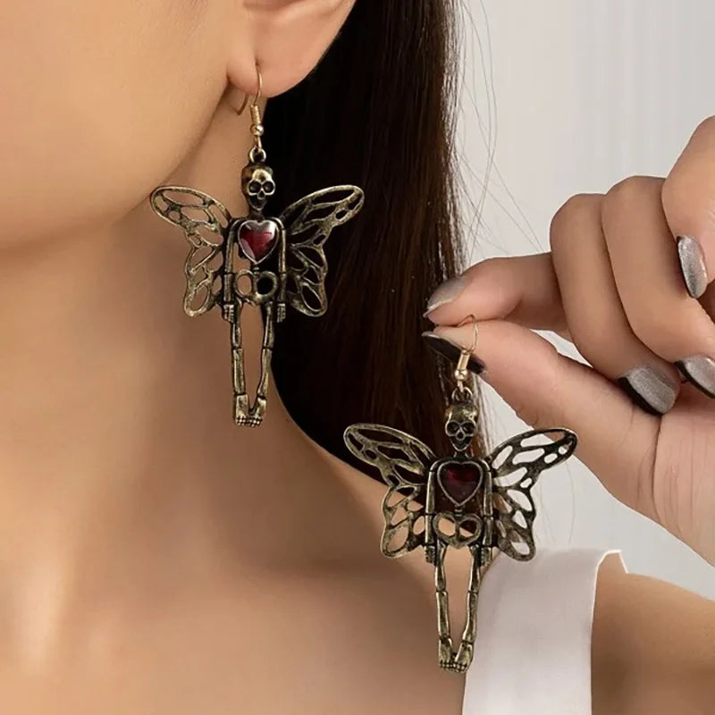 Pendientes colgantes de hada esqueleto con alas de mariposa y calavera
