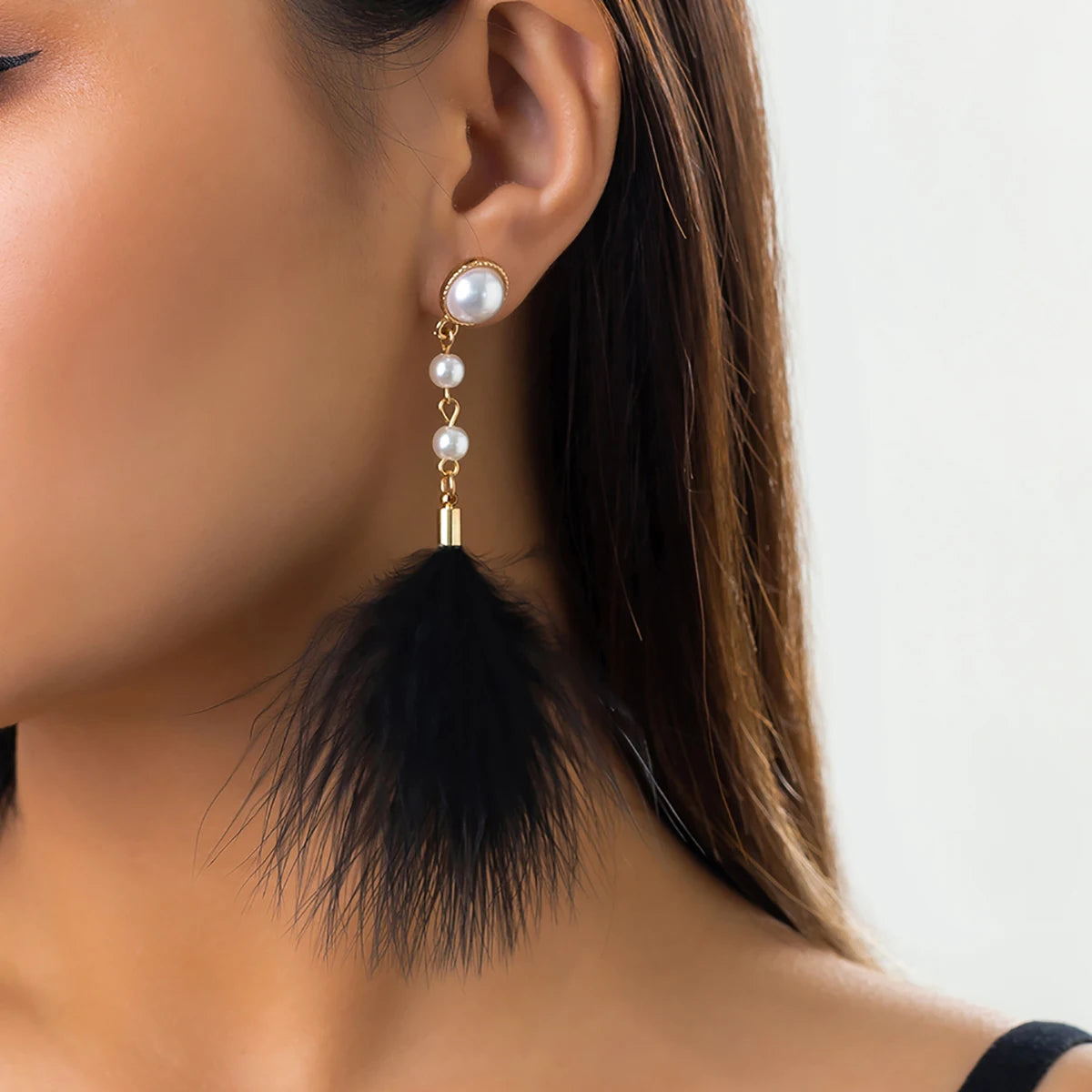 Pendientes colgantes perlas y plumas 
