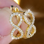 Sparkling infinity symbol drop earrings gold
