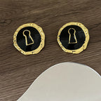 Pendientes redondos llave negro
