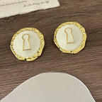 Pendientes redondos llave blanco