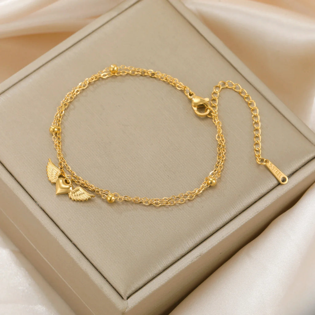 Pulsera ajustable alas de ángel dorada