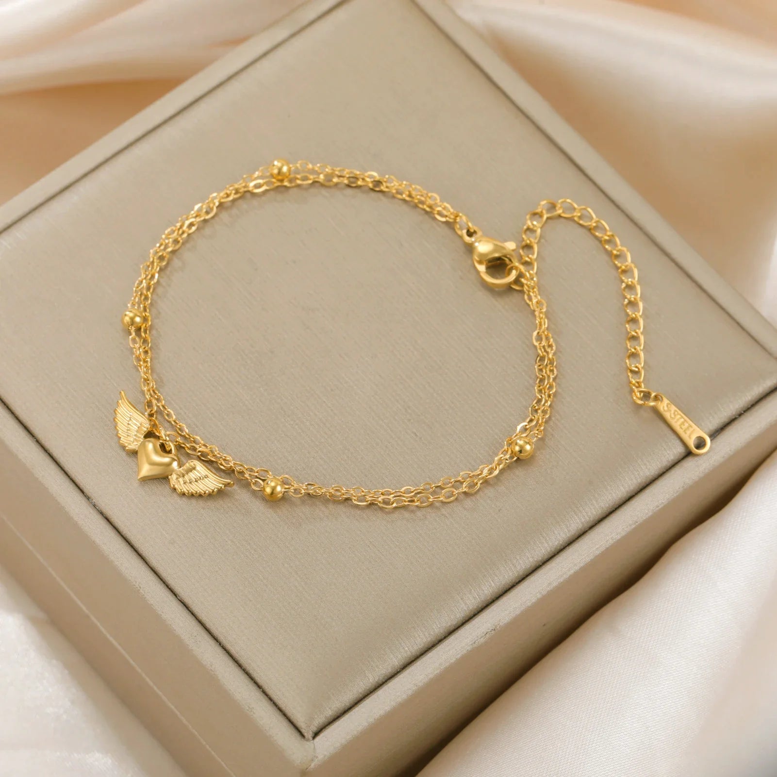 Pulsera ajustable alas de ángel dorada