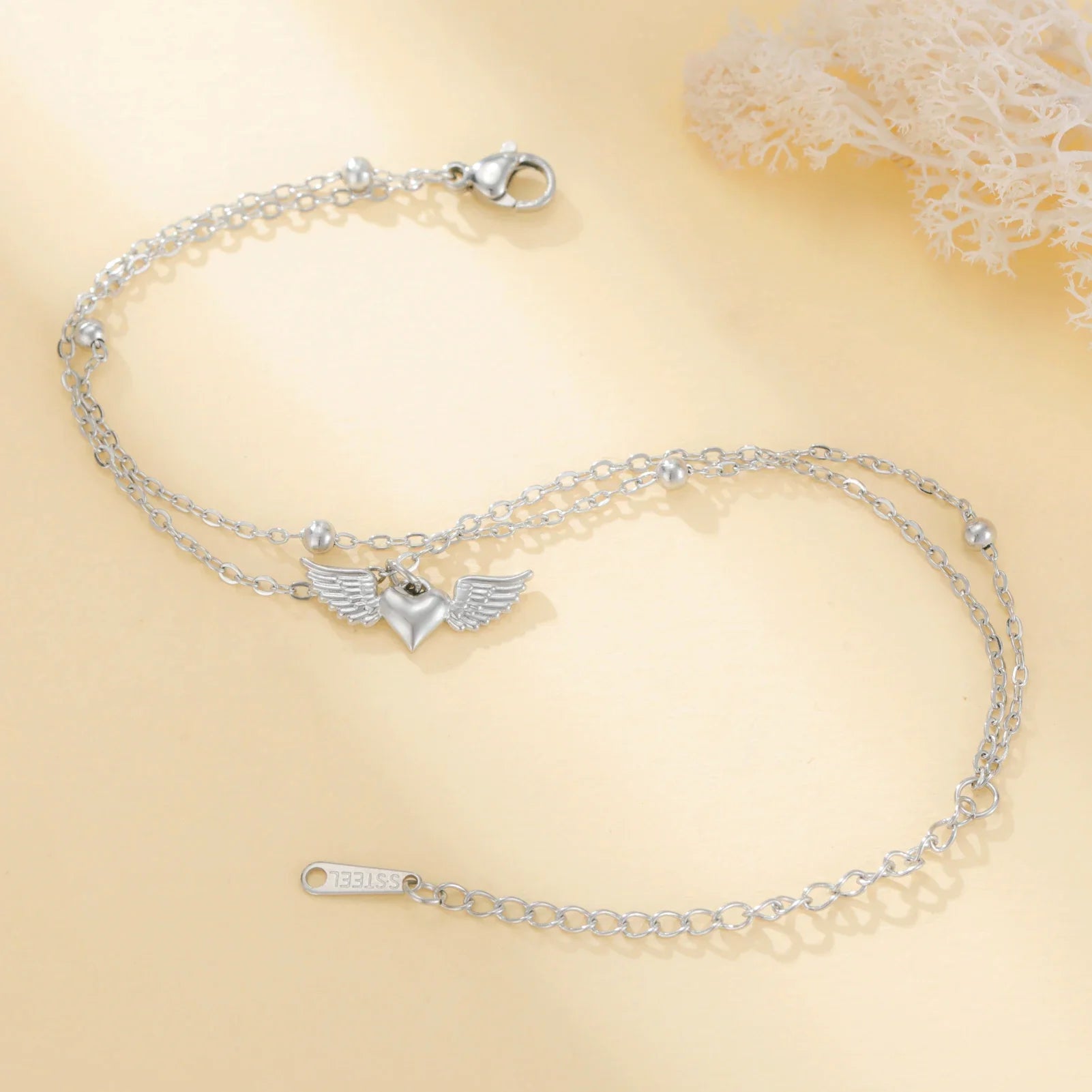 Pulsera ajustable alas de ángel plateada