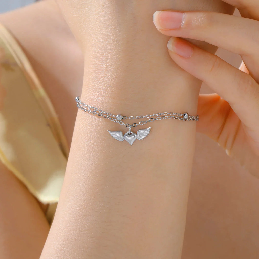 Pulsera ajustable alas de ángel plateada
