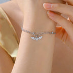 Pulsera ajustable alas de ángel plateada